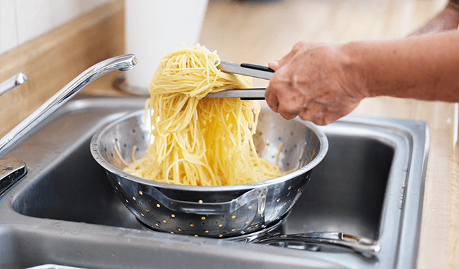 To prevent Pasta from sticking together, make sure to  add it to the Water Before it has Boiled, as well as adding enough amount of salt to the cooking water.